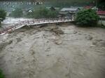 　台風７号の影響で一部が崩落した鳥取市の佐治川に架かる高山橋＝１５日夕（鳥取県河川課提供）