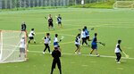 練習試合をするラクロスの選手たち＝２１日、大山町加茂