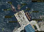 　２０２２年９月１８日に撮影された北朝鮮・東部新浦の造船所の衛星写真。１潜水艦進水用埠頭、２進水用レール上のけん引設備、３小型船、４けん引台船、５クレーン台船、６小型船、７浮きドライドック、８潜水艦建造施設（プレアデス・ネオ（Ｃ）エアバスＤＳ２０２２、エアバス・ディフェンス・アンド・スペース／３８ノース提供・共同）