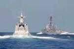 　南シナ海で米駆逐艦（右）が中国の艦船に異常接近したとする動画の一場面（中国国防省のホームページより、共同）