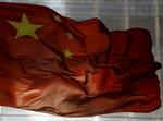 　はためく中国国旗＝２０１５年１０月、北京（ロイター＝共同）