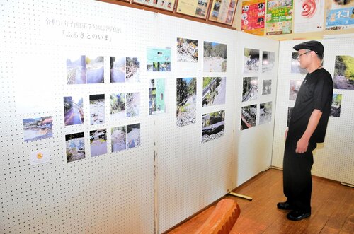 ひび割れた道路など自然の脅威を感じる写真が並ぶ