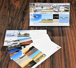 利用者らから寄せられた多くの写真を組み写真としてデザインした２５年版カレンダー