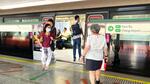 　シンガポールの鉄道駅の風景。通勤時間の混雑時には保安要員がきびきびと通勤客を誘導する