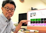 人工染色体を搭載したブタについて説明する香月教授＝米子市西町の鳥取大医学部