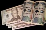 　米ドルと日本円の紙幣（ロイター＝共同）